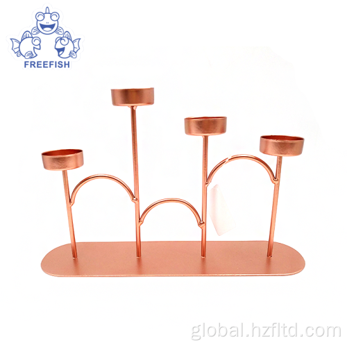 China Rose Gold Metal 4 Arm Candlestick Holder Set Supplier